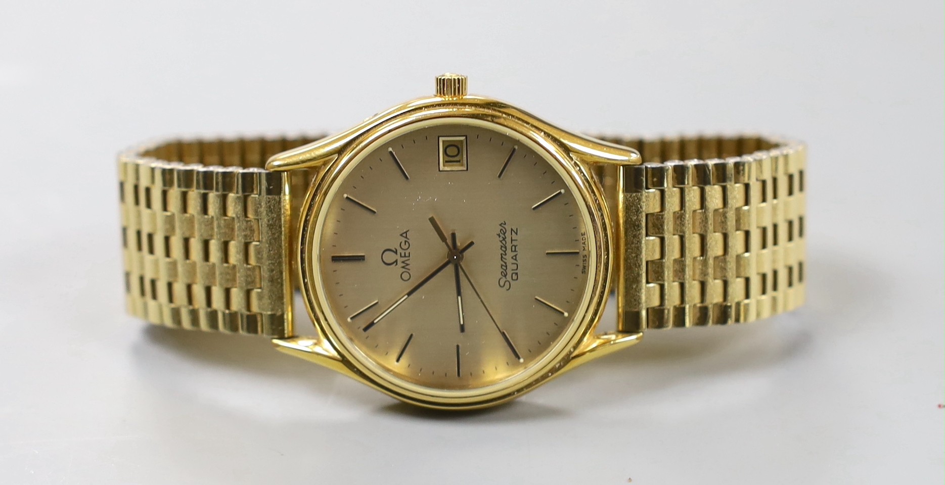 A gentleman's steel and gold plated Omega Seamaster quartz wrist watch, with spare links and Omega box.